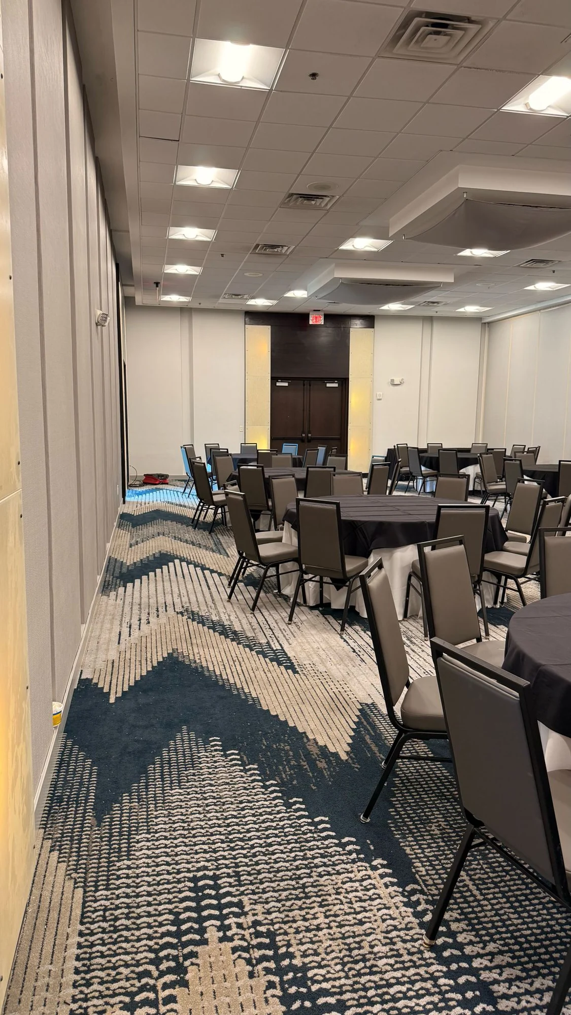 Installed wallcovering and trim beside the banquet seating · Hotel Alba Tampa, Tapestry Collection by Hilton