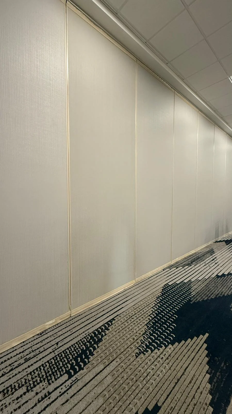 Installed light wallcovering between vertical trim details · Hotel Alba Tampa, Tapestry Collection by Hilton