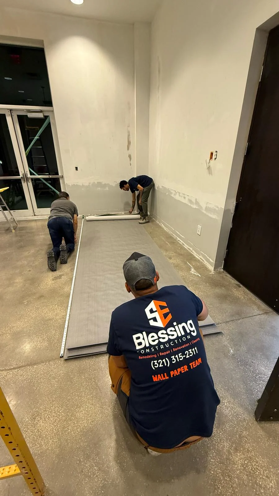 SE Blessing crew measuring wallcovering material before installation · Hotel Alba Tampa, Tapestry Collection by Hilton