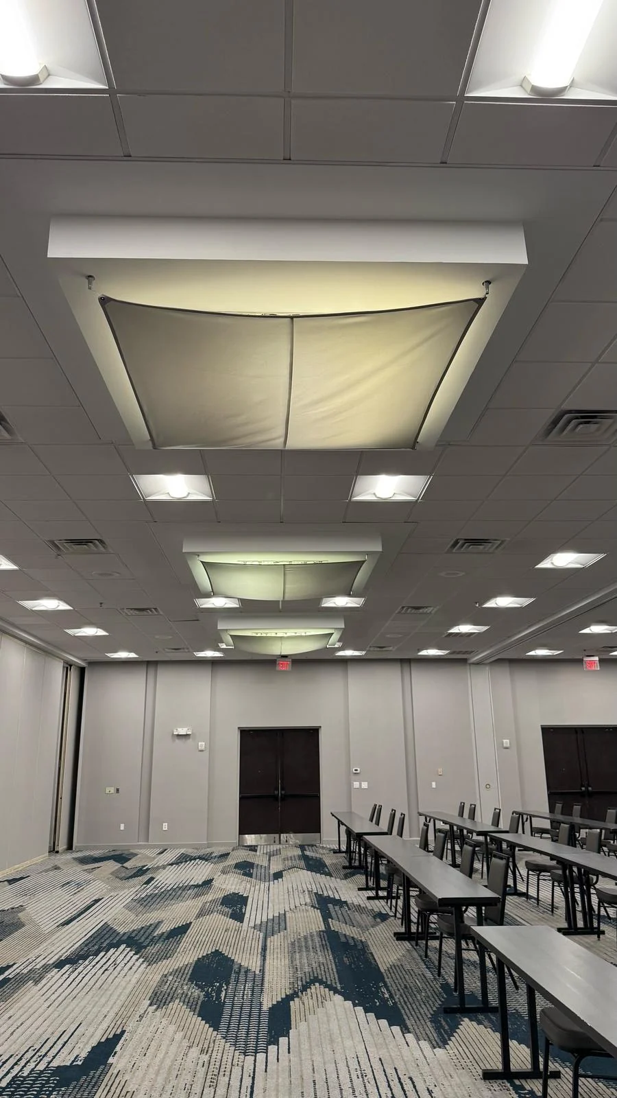 Installed ballroom wallcovering around the double doors with meeting tables in place · Hotel Alba Tampa, Tapestry Collection by Hilton