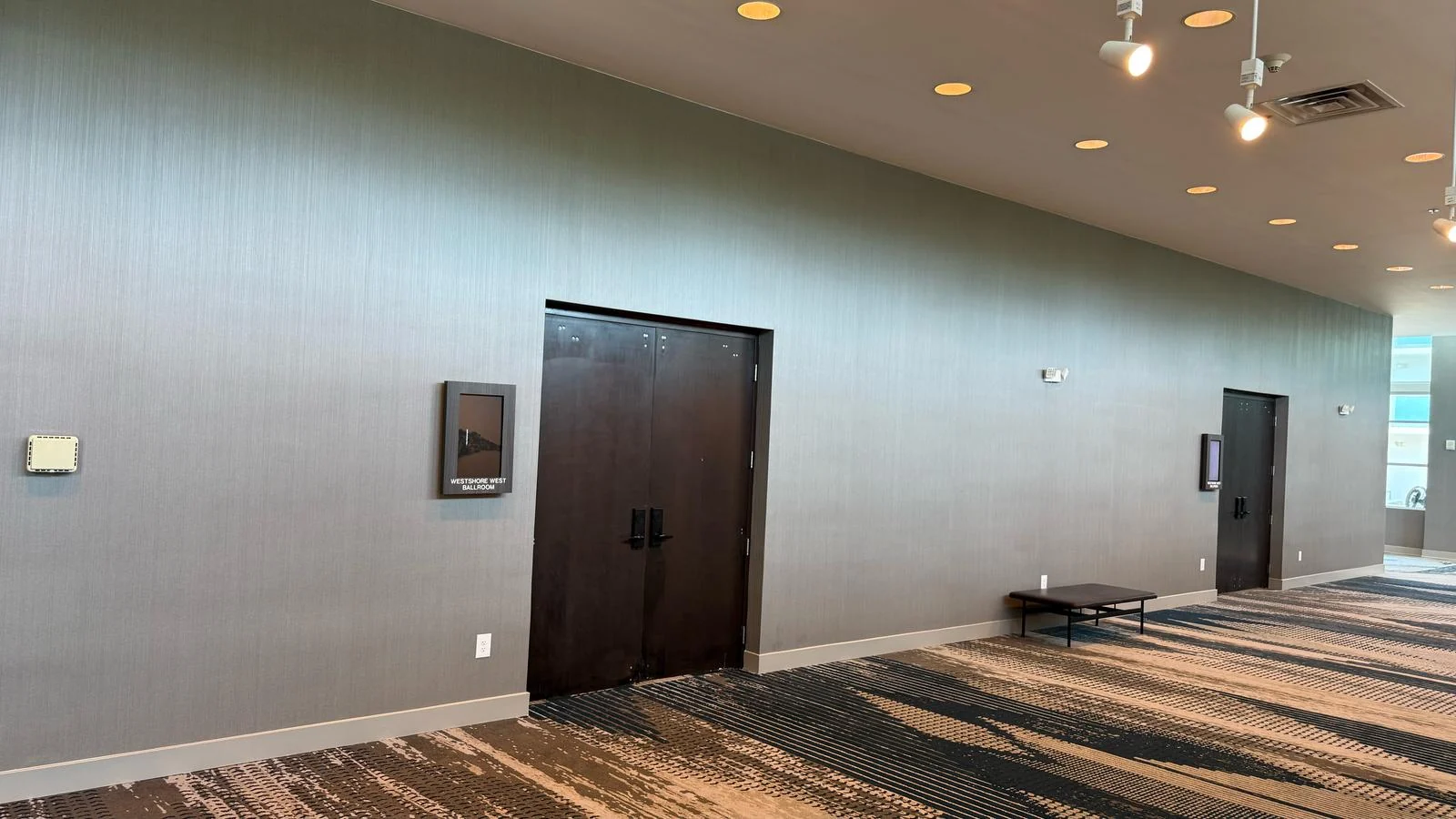 Installed wallcovering across the wall between ballroom entrances · Hotel Alba Tampa, Tapestry Collection by Hilton