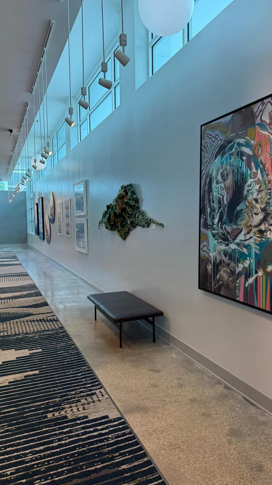 Installed wallcovering behind the hallway art display · Hotel Alba Tampa, Tapestry Collection by Hilton