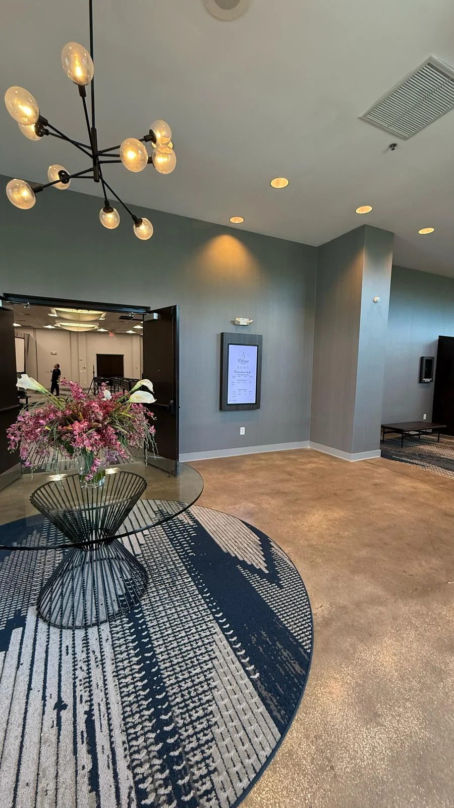Installed textured wallcovering around the ballroom entry and adjacent column · Hotel Alba Tampa, Tapestry Collection by Hilton