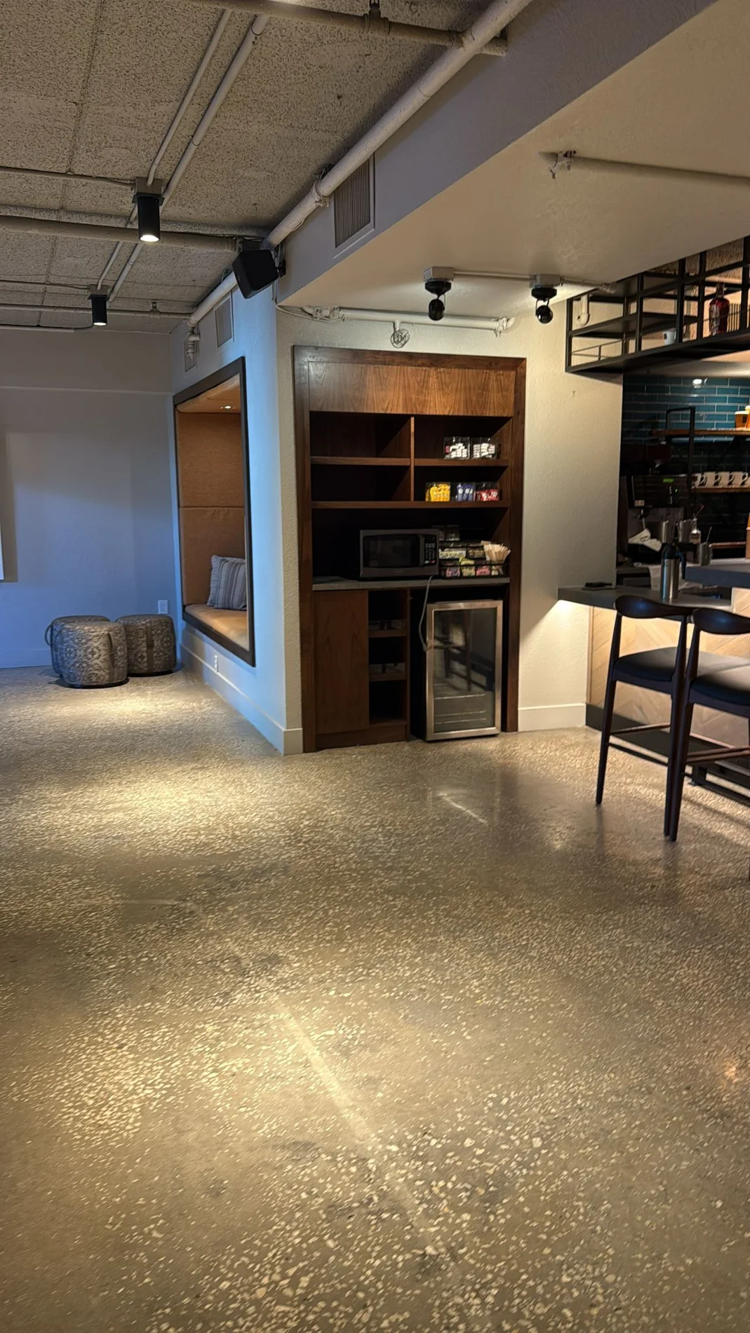Finished passage with shelving and wood wall detail at Buffalo Lounge