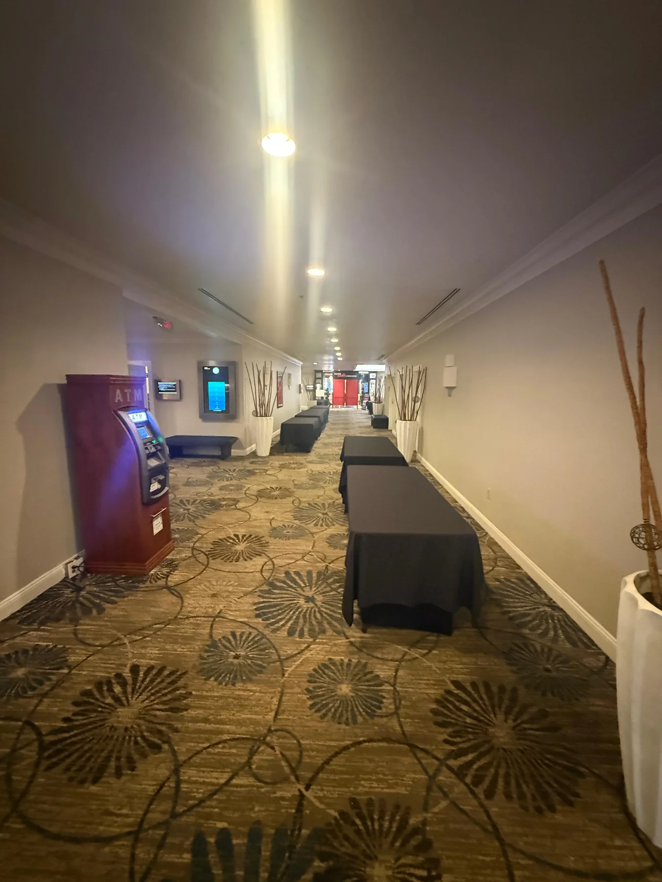 Existing carpet along the corridor toward the restaurant entrance at DoubleTree by Hilton, Jacksonville