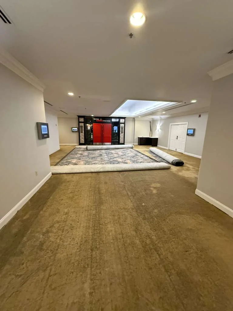 Exposed floor and replacement carpet rolls in the corridor at DoubleTree by Hilton, Jacksonville