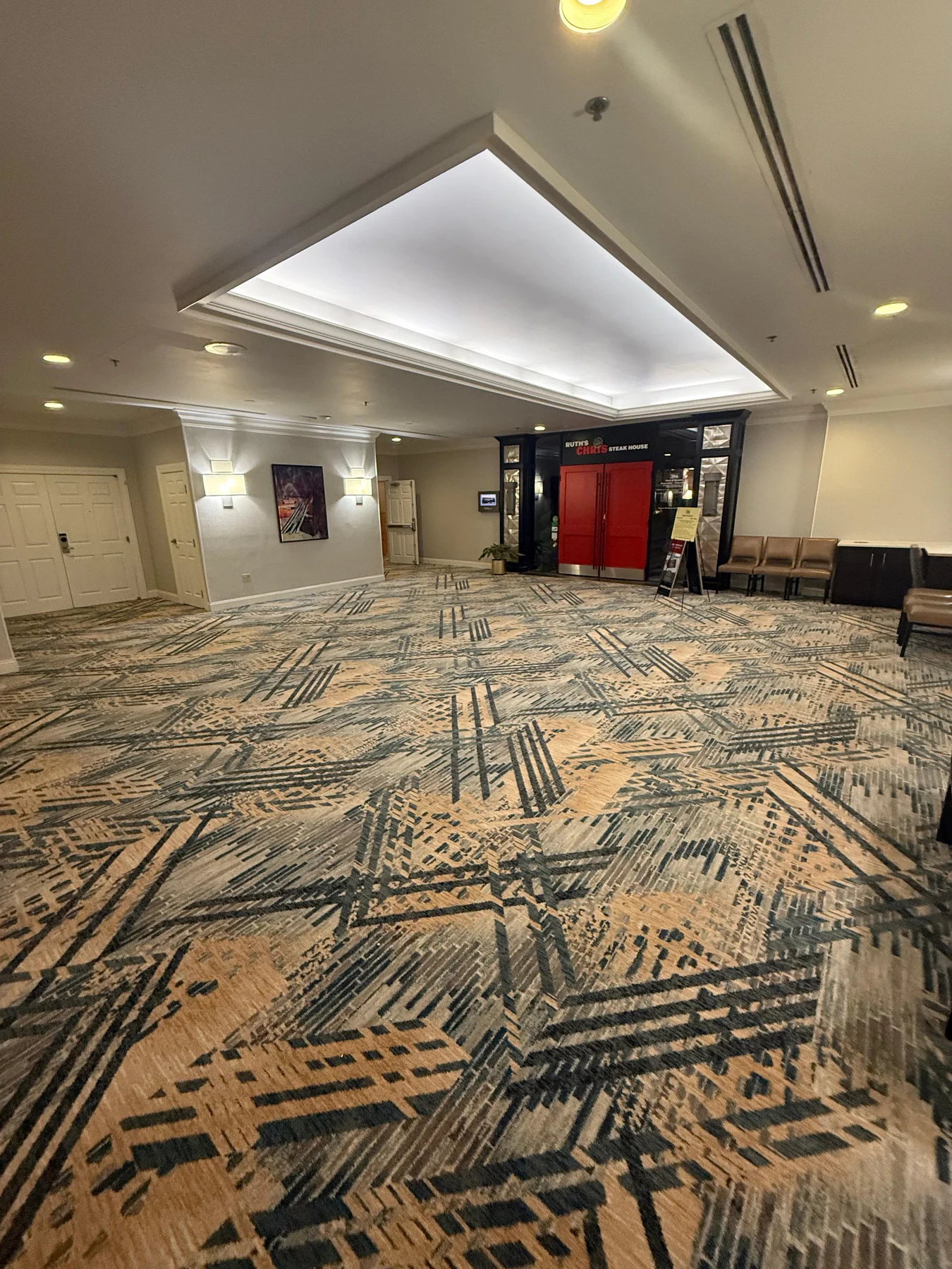 Installed carpet across the widened corridor at the restaurant entrance at DoubleTree by Hilton, Jacksonville
