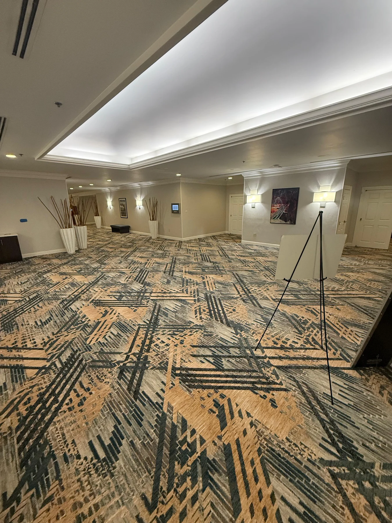 Installed carpet continuing around the corridor junction at DoubleTree by Hilton, Jacksonville