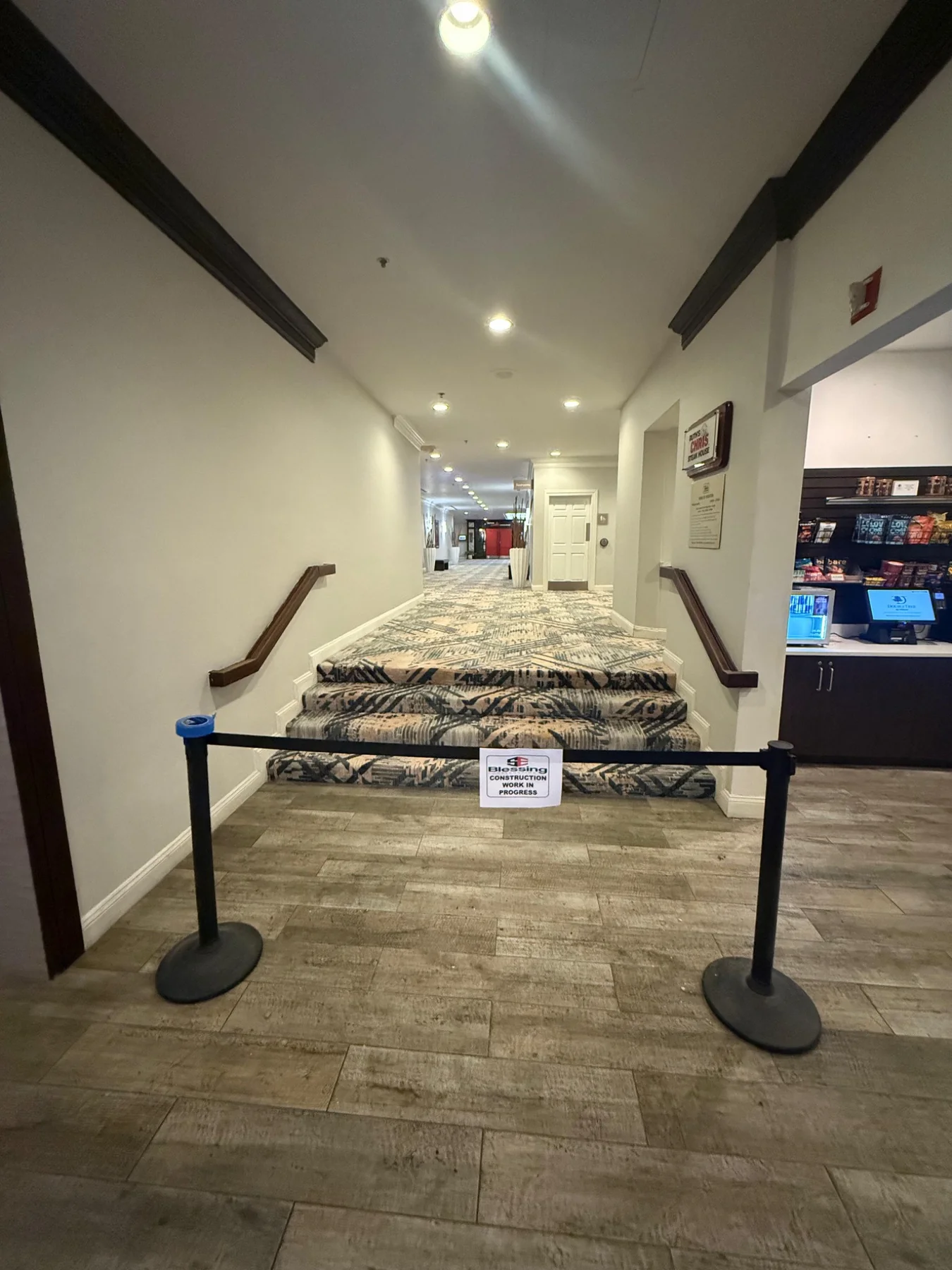 New patterned carpet fitted across the hallway steps and landing, with the work-in-progress barrier still in place at DoubleTree by Hilton, Jacksonville