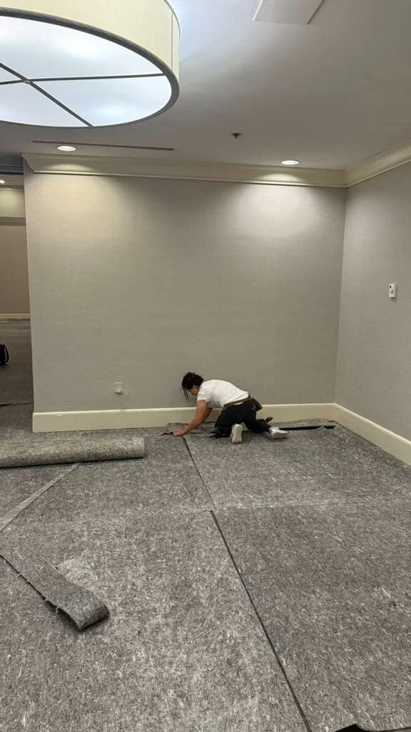 Fitting the underlayer along the room edge at DoubleTree by Hilton, Jacksonville