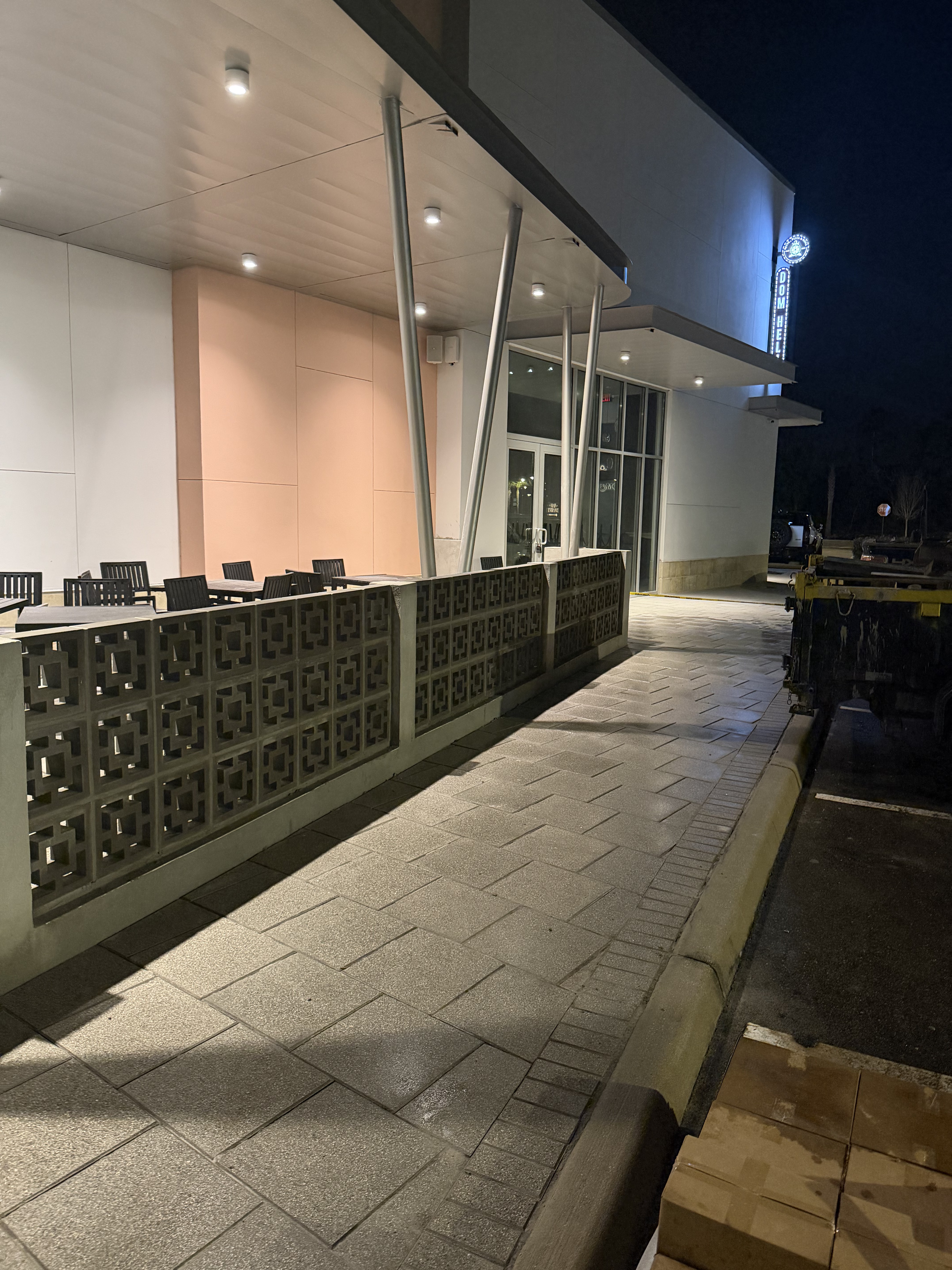Canopy lighting and a view along the restaurant facade.